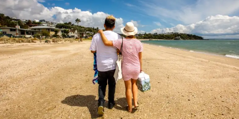 couple walking along beach