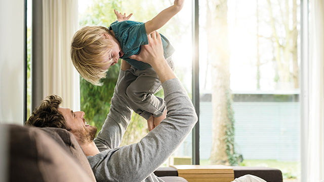 Man playing with child.