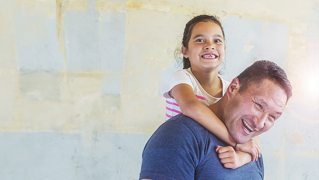 Dad and daughter laughing 