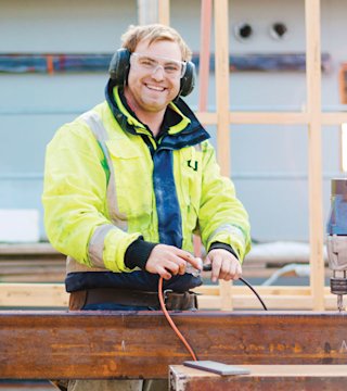 Man in safety gear at construction site