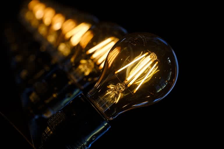 Row of glowing light bulbs