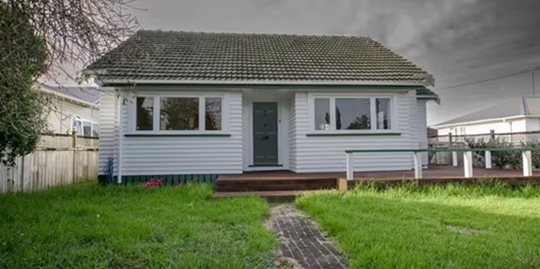 white and green house