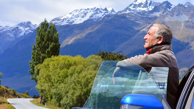 Man leans on car door