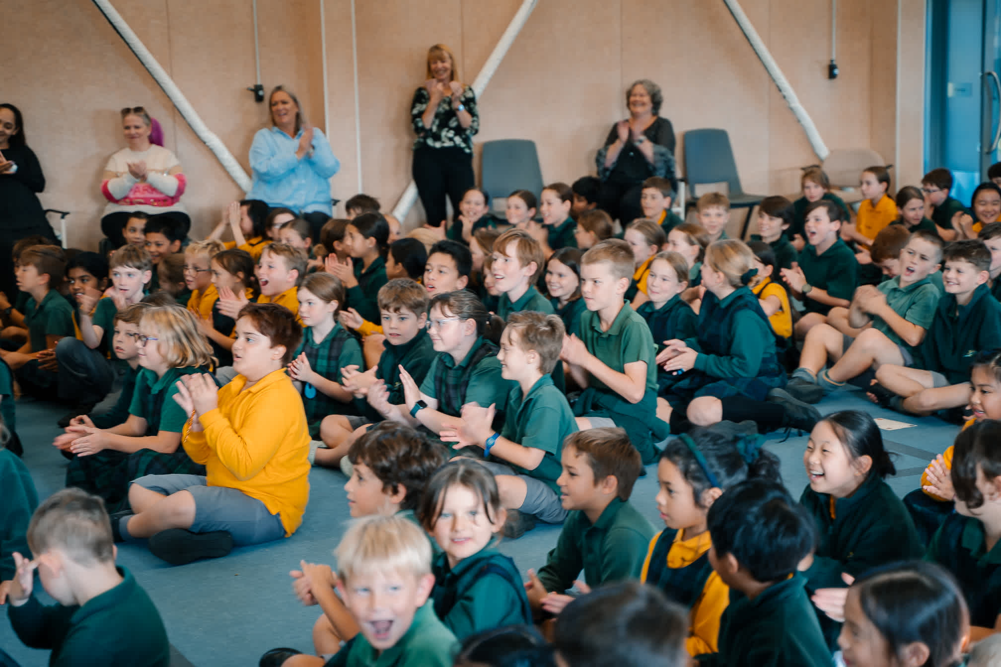 Students finding out they had won the Big Little Sponsorship during assembly.