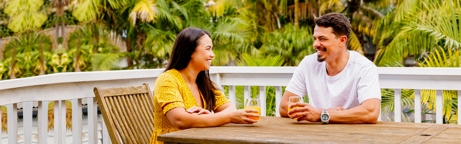 Couple at outdoor table.