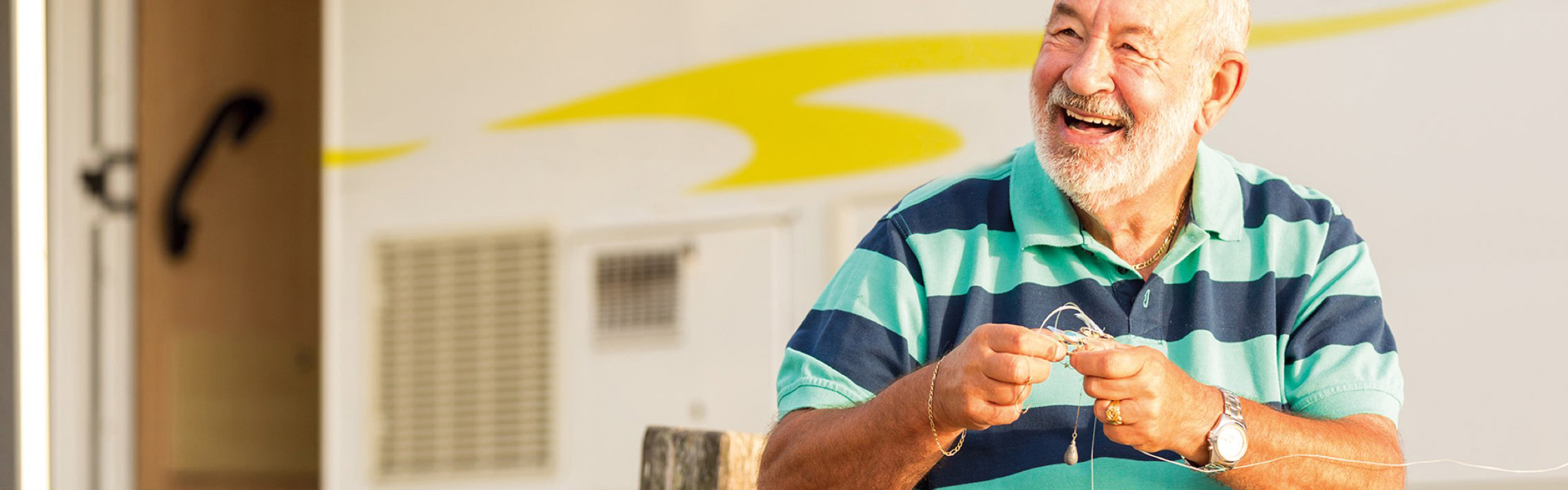 A man sitting outside a motorhome